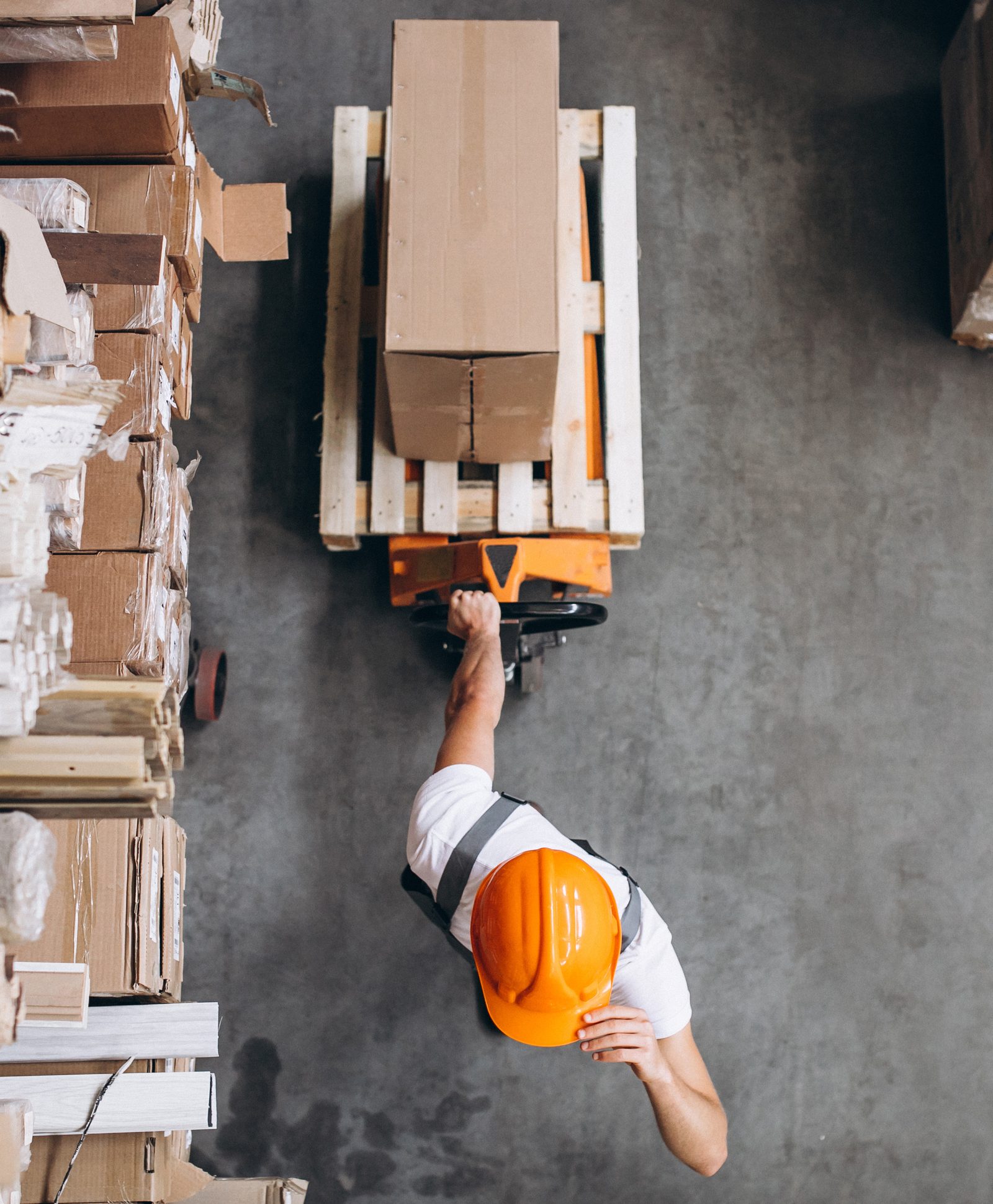 Forklift moving pallets in a logistics warehouse